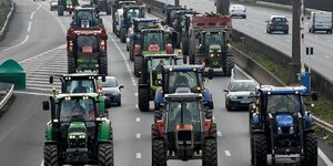 French farmers drive their tractors on the a7 highway to protest changes in underprivileged farm area's mapping and against mercosur talks, in solaize
