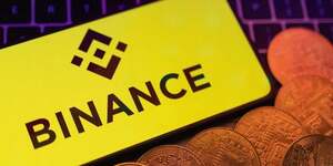 Une illustration du logo binance et des crypto-monnaies